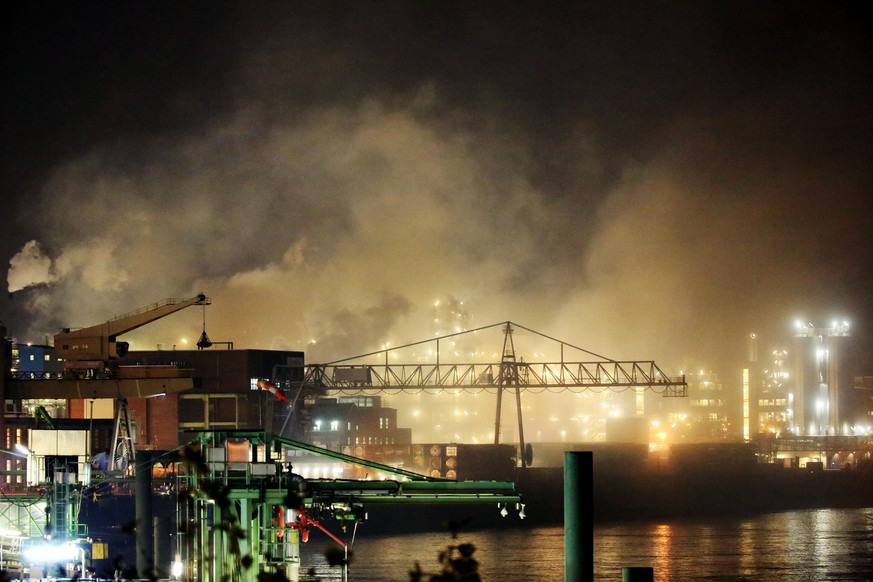 epa05629136 Smoke rises from the site of a chemical plant in Leverkusen, Germany, 12 November 2016. Due to a fire in Leverkusen Chemical Park, the fire brigade asked thousands of residents in Leverkus ...