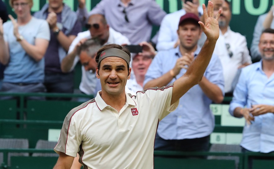 epa07664226 Roger Federer from Switzerland celebrates winning against Roberto Bautista Agut from Spain in their quarter final match at the ATP Tennis Tournament Noventi Open (former Gerry Weber Open)  ...