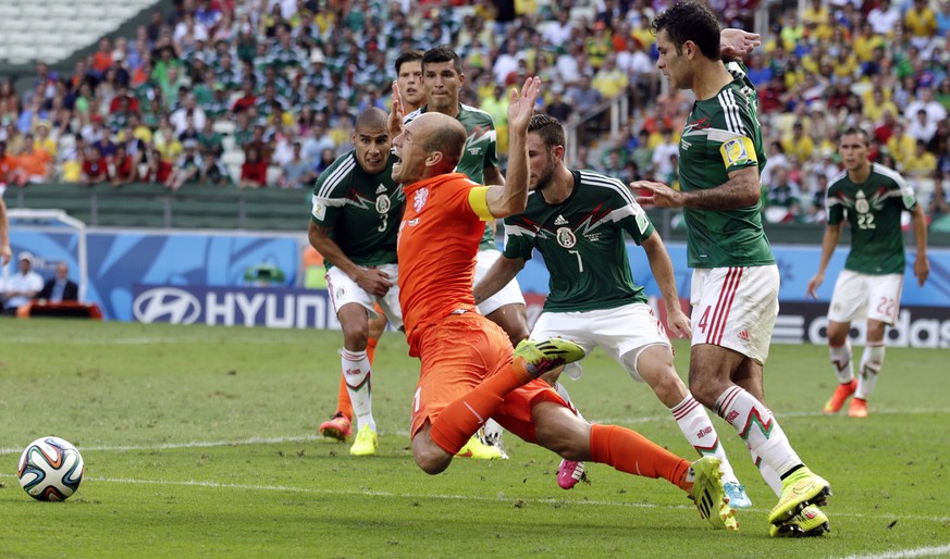 Netherlands&#039; Arjen Robben, center, goes down to win a penalty during the World Cup round of 16 soccer match between the Netherlands and Mexico at the Arena Castelao in Fortaleza, Brazil, Sunday,  ...