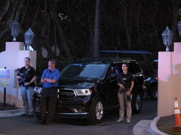 Armed Secret Service agents stand outside an entrance to former President Donald Trump's Mar-a-Lago estate, late Monday, Aug. 8, 2022, in Palm Beach, Fla. Trump said in a lengthy statement that the FB ...