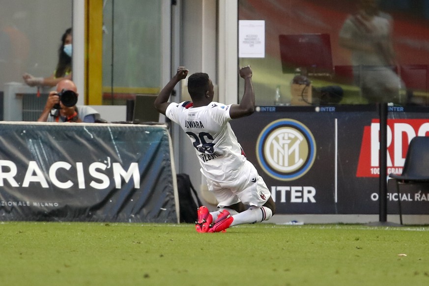 Bologna&#039;s Musa Juwara celebrates after scoring his side&#039;s opening goal during the Serie A soccer match between Inter Milan and Bologna at the Milan San Siro Stadium, Italy, Sunday, July 5, 2 ...