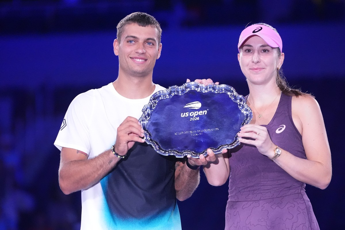 Belinda Bencic, of Switzerland, and Flavio Cobolli, of Italy, hold the trophy for runner up after they lost to Jakub Mensik, of the Czech Republic, and Karolina Muchova, of the Czech Republic, in mixe ...