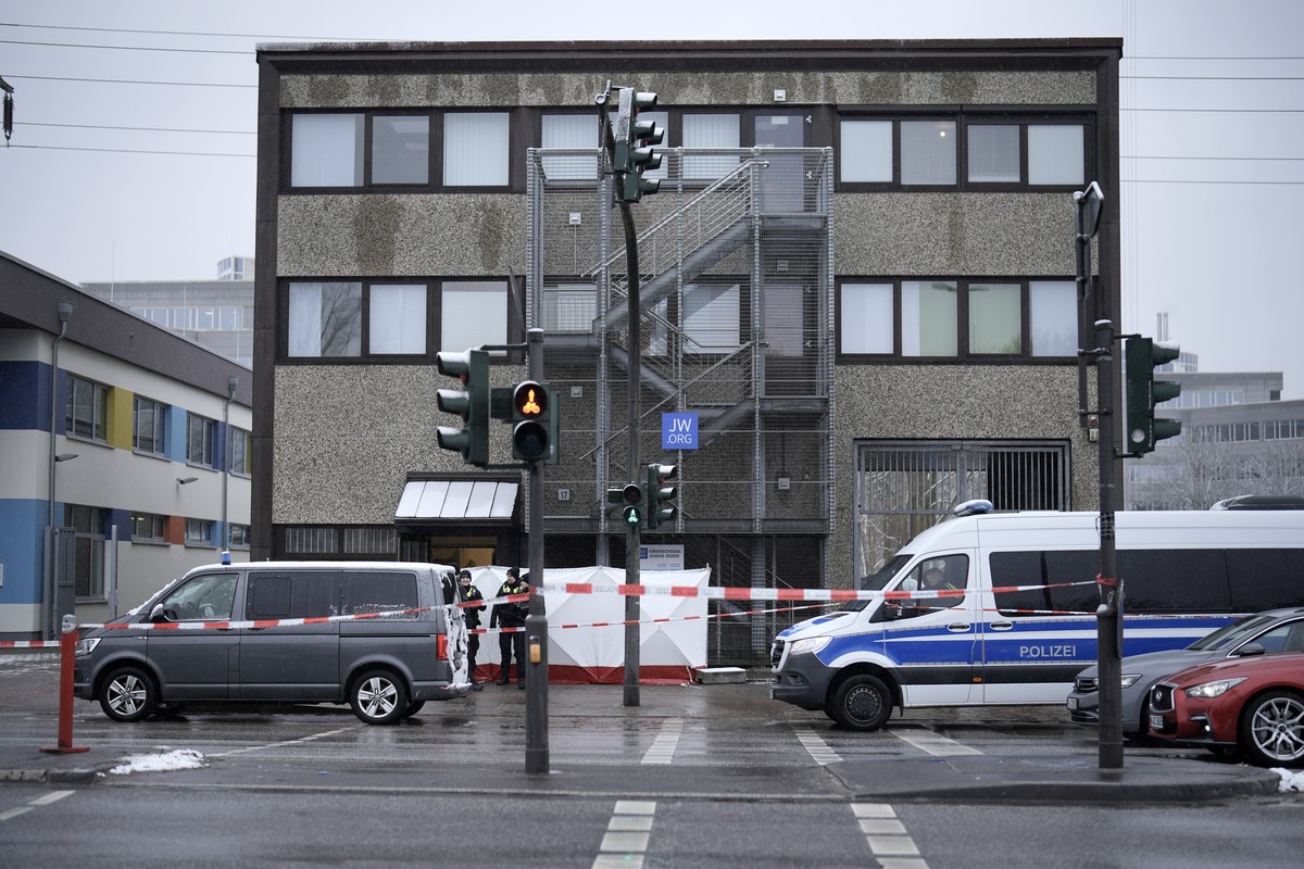 Police secured a street outside a Jehovah's Witness building in Hamburg, Germany Friday, March 10, 2023. Shots were fired inside the building used by Jehovah's Witnesses in the northern Germ ...