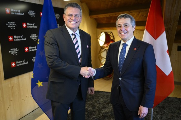 Swiss Foreign Minister Ignazio Cassis, right, shakes hands with Maros Sefcovic, Executive Vice-President of the European Commission, left, ahead of a bilateral meeting in the H...