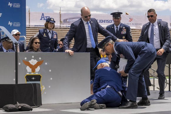 President Joe Biden falls on stage during the 2023 United States Air Force Academy Graduation Ceremony at Falcon Stadium, Thursday, June 1, 2023, at the United States Air Force Academy in Colorado Spr ...