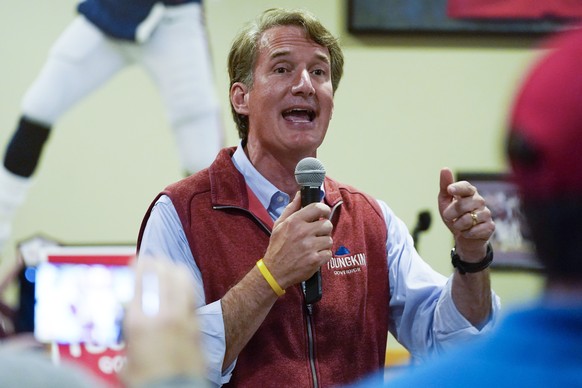 FILE - In this Oct. 11, 2021, file photo Virginia Republican gubernatorial candidate Glenn Youngkin talks to supporters during a meet and greet at a sports bar in Chesapeake, Va. Youngkin faces former ...