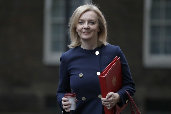 Liz Truss, Britain&#039;s Secretary of State for International Trade, walks across Downing Street to attend a Cabinet meeting in London, Tuesday, Oct. 20, 2020. (AP Photo/Kirsty Wigglesworth)