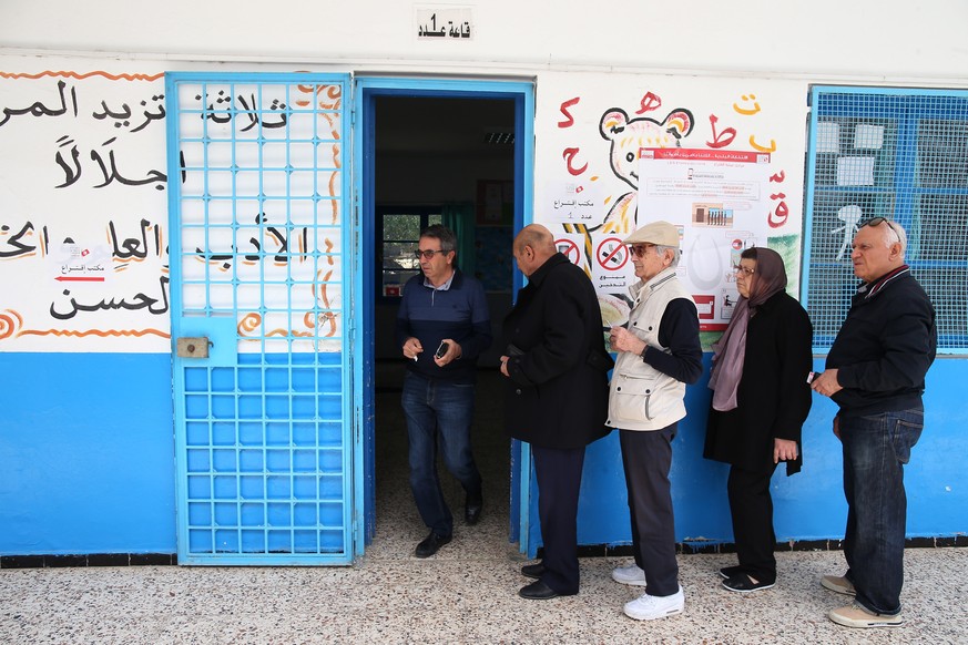 epa06714631 Voters stand in line to cast their ballots at a polling station during the municipal elections in Tunis, Tunisia, 06 May 2018. The municipal elections, which is held for the first time in  ...