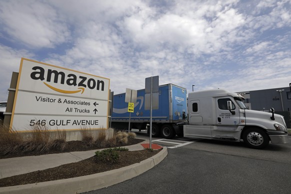 epa09907194 An Amazon truck drives out of the Amazon&#039;s Staten Island fulfillment center in Staten Island, New York, USA, 24 April 2022. On 01 April 2022 workers at the Staten Island facility vote ...