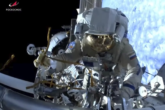 In this photo taken from video footage released by Roscosmos Space Corporation, Russian cosmonauts Oleg Kononenko and Nikolai Chub conduct a spacewalk outside the International Space Station (ISS), We ...