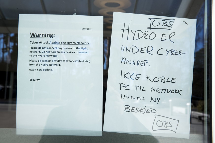 epa07448269 A warning note is pasted at a door of the Norwegian company Hydro in Oslo, Norway, 19 March 2019. The Norwegian company Hydro's global business is exposed to a comprehensive cyber attack t ...
