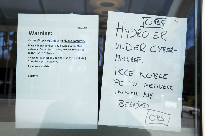 epa07448269 A warning note is pasted at a door of the Norwegian company Hydro in Oslo, Norway, 19 March 2019. The Norwegian company Hydro&#039;s global business is exposed to a comprehensive cyber att ...