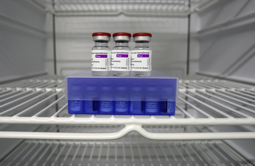 AstraZeneca and Biontech coronavirus vaccine stand in a fridge at the vaccine center in Ebersberg near Munich, Germany, Monday, March 22, 2021. (AP Photo/Matthias Schrader)