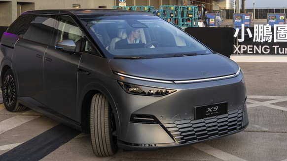 An XPeng X9 electric vehicle is displayed at the company's showcase event in Hong Kong on Tuesday, April 15, 2025. (AP Photo/Chan Long Hei)
Hong Kong XPeng Auto Show
