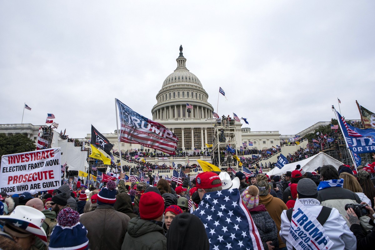 FILE - Rioters loyal to President Donald Trump rally at the U.S. Capitol in Washington on Jan. 6, 2021. Ronald Colton McAbee, who was employed as a Tennessee sheriff's deputy when he assaulted po ...