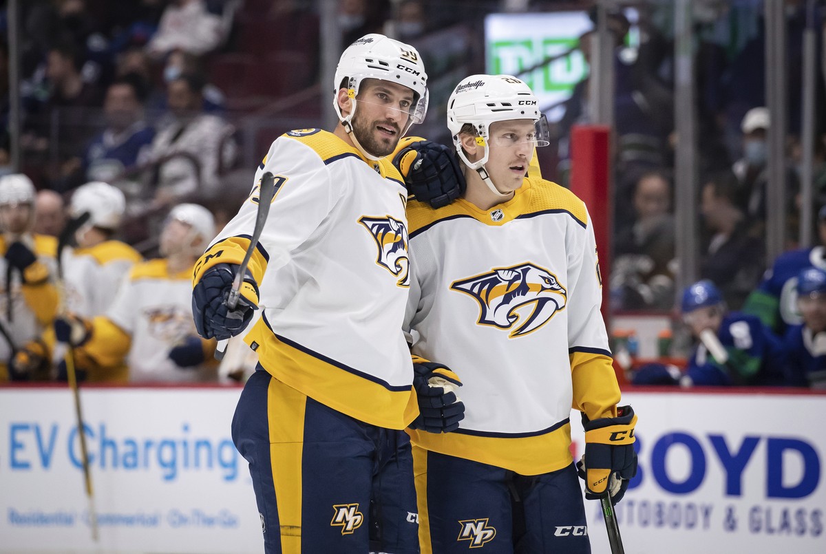 Nashville Predators' Roman Josi, left, and Eeli Tolvanen celebrate Josi's goal against the Vancouver Canucks during the first period of an NHL hockey game Friday, Nov. 5, 2021, in Vancouver, ...