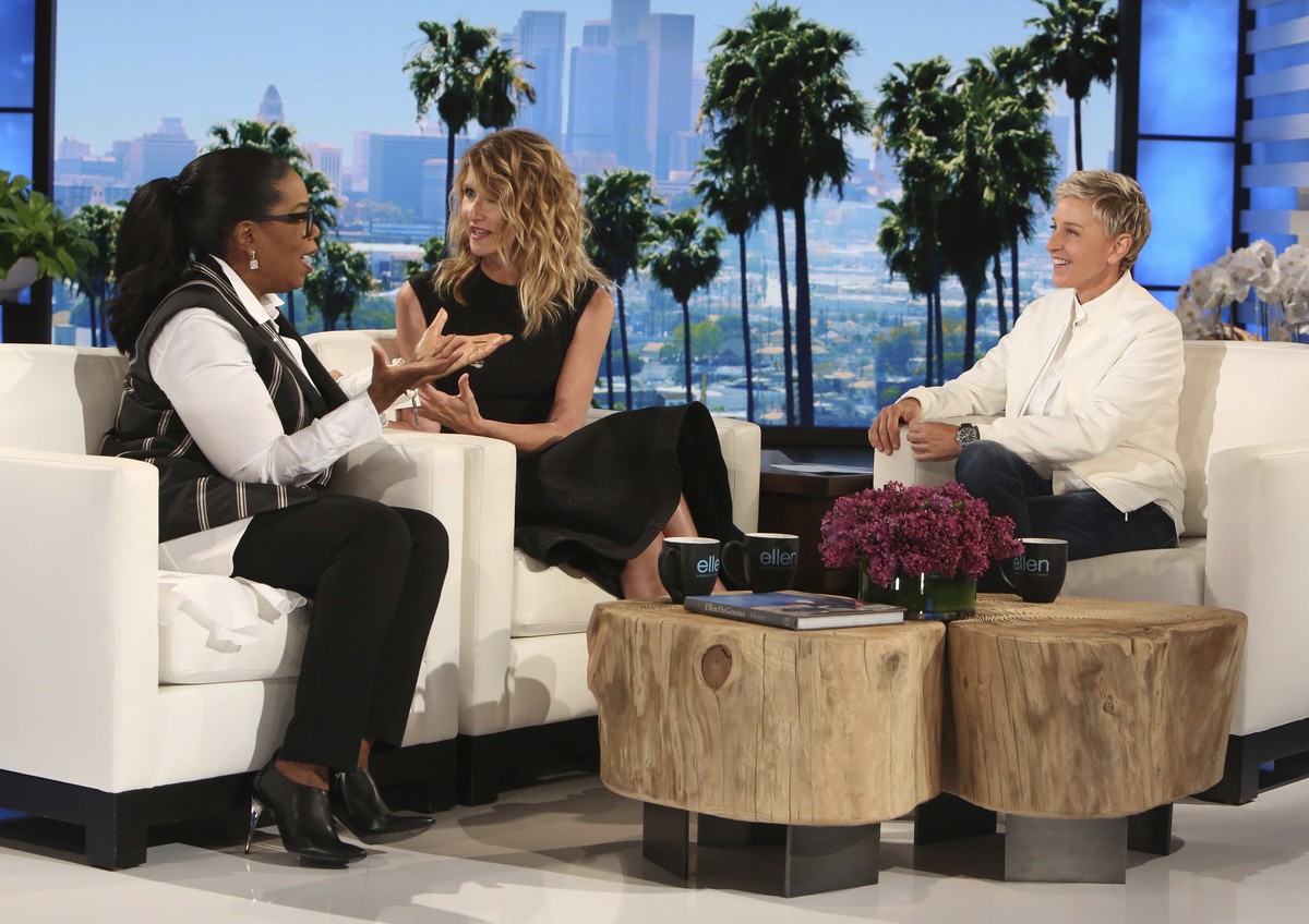 In this April 5, 2017 photo released by Warner Bros., Oprah Winfrey, left, and Laura Dern appear with host Ellen DeGeneres at a taping of "The Ellen DeGeneres Show" in Burbank, Calif. Twenty ...