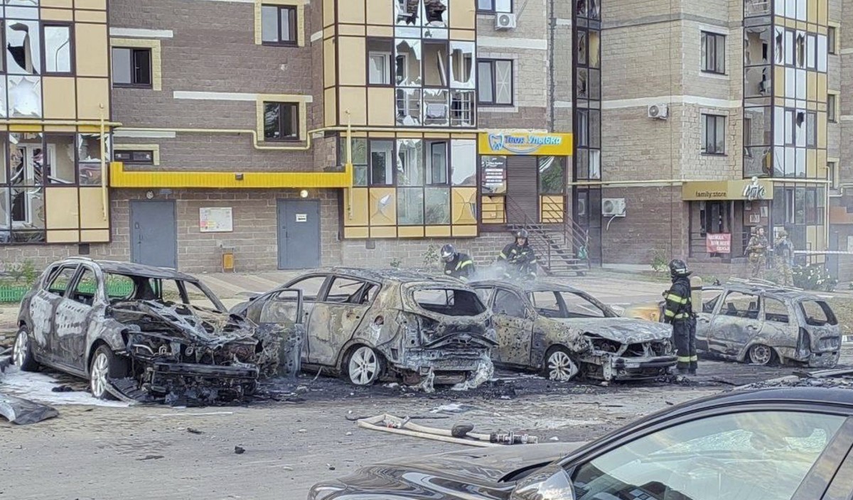 epa11579884 A handout photo made available on the Governor of the Belgorod Region Vyacheslav Gladkov's telegram channel, shows firefighters at the scene of an impact following Ukraine shelling in ...