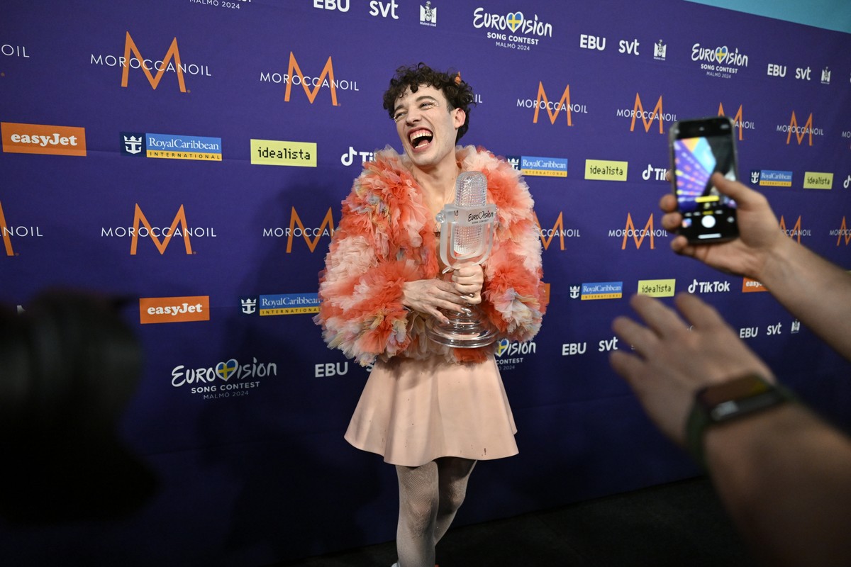 epa11334296 Nemo representing Switzerland with the song 'The Code' poses in the press room after winning the 68th edition of the Eurovision Song Contest (ESC) at the Malmo Arena, in Malmo, S ...