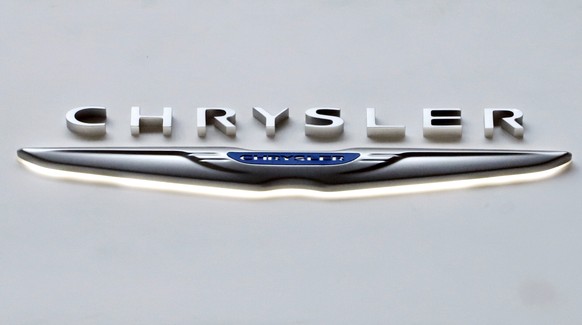 FILE - This Feb. 14, 2019 file photo shows the Chrysler logo at the 2019 Pittsburgh International Auto Show in Pittsburgh. The U.S. government is ending an investigation, Friday, April 8, 2022, into c ...