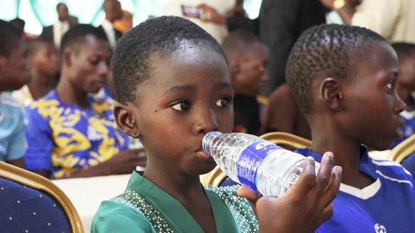 Freed students of St. Mary's Catholic School in the Papiri community, drink water and rest upon arrival at the government house in Minna, Nigeria, Monday, Dec. 8, 2025. (AP Photo)
Nigeria Abducti ...
