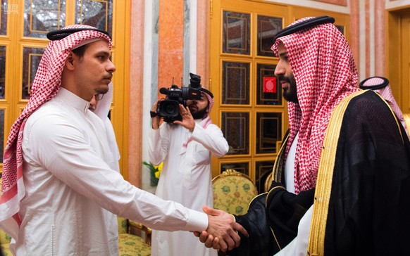 In this photo released by the Saudi Press Agency, Saudi Crown Prince Mohammed bin Salman, right, shakes hands with Salah Khashoggi, a son of Jamal Khashoggi, in Riyadh, Saudi Arabia, on Oct. 23, 2018. ...