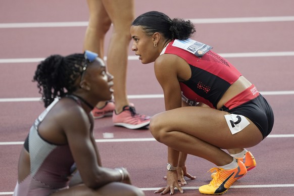 Ditaji Kambundji, of Switzerland, reacts after finishing a Women&#039;s 100-meters hurdles heat during the World Athletics Championships in Budapest, Hungary, Tuesday, Aug. 22, 2023. (AP Photo/Martin  ...