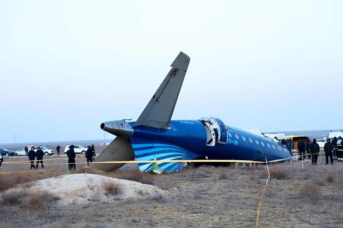 In this photo taken from a video released by the administration of Mangystau region, a part of Azerbaijan Airlines' Embraer 190 lies on the ground near the airport of Aktau, Kazakhstan, on Thursd ...