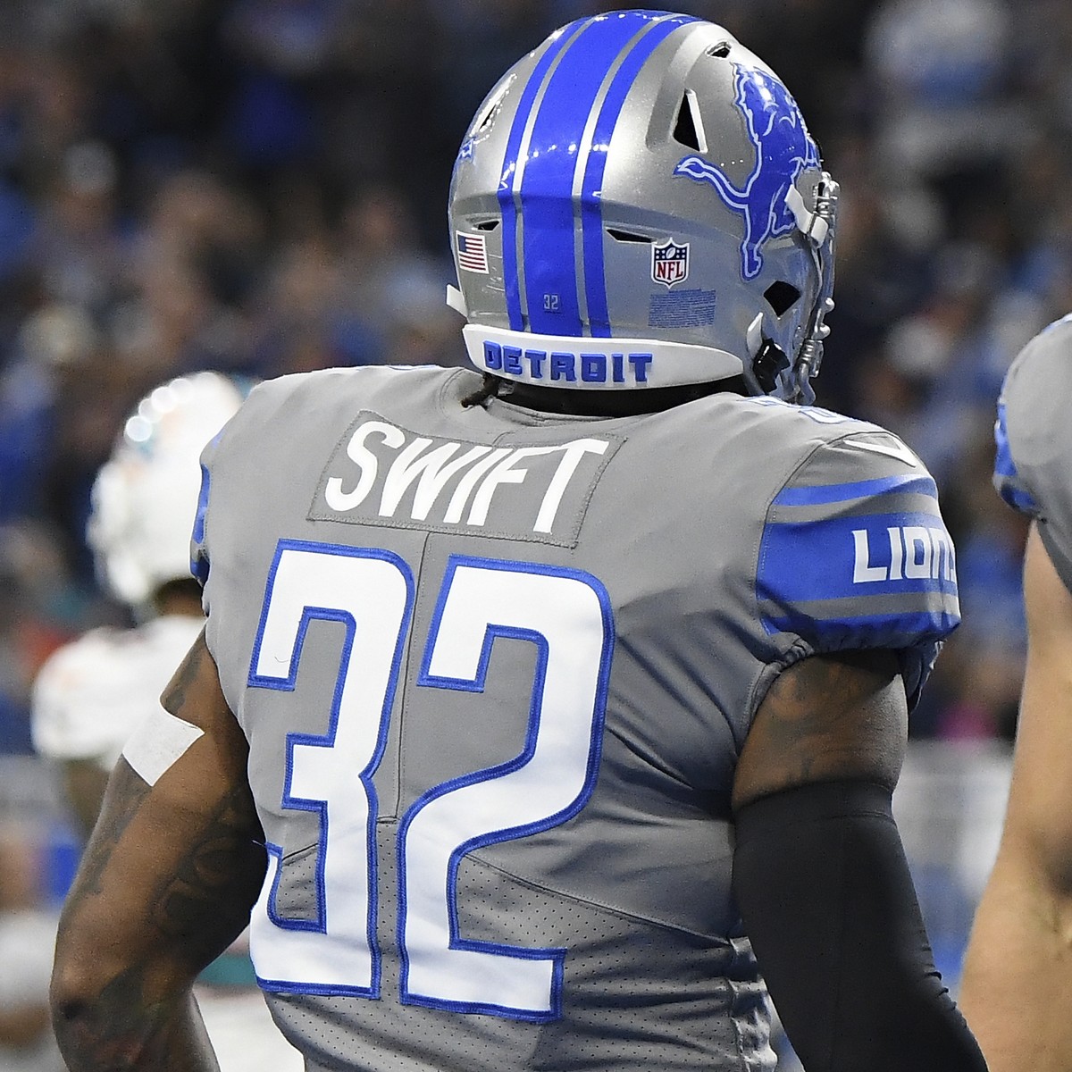 Detroit Lions running back D'Andre Swift (32) is greeted by tight end T.J. Hockenson (88) after scoring on a 7-yard run during the first half of an NFL football game against the Miami Dolphins, S ...