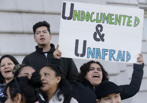 Lordes Reboyoso, right, yells at a rally outside of City Hall in San Francisco, Wednesday, Jan. 25, 2017. President Donald Trump moved aggressively to tighten the nation&#039;s immigration controls We ...