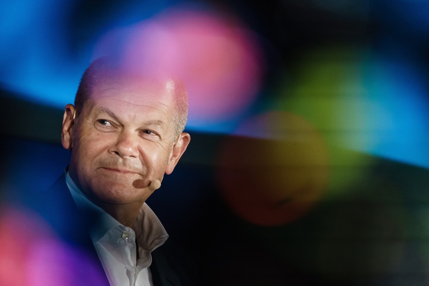 epa09374735 German Minister of Finance and Social Democratic Party (SPD) top candidate for the federal elections Olaf Scholz looks on as he attends the Brigitte Live talk in Berlin, Germany, 28 July 2 ...