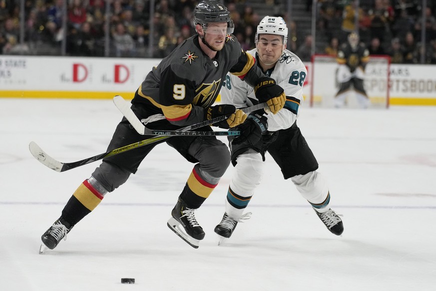 Vegas Golden Knights center Jack Eichel (9) skates around San Jose Sharks right wing Timo Meier (28) during overtime of an NHL hockey game Sunday, April 24, 2022, in Las Vegas. (AP Photo/John Locher)