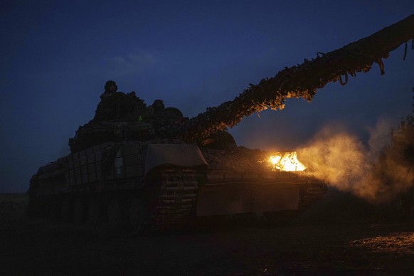 A Ukrainian tank of the 110th brigade moves through a field as it returns from a position at the frontline on Pokrovsk direction, Donetsk region, Ukraine, Wednesday, Sept. 18, 2024. (AP Photo/Evgeniy  ...