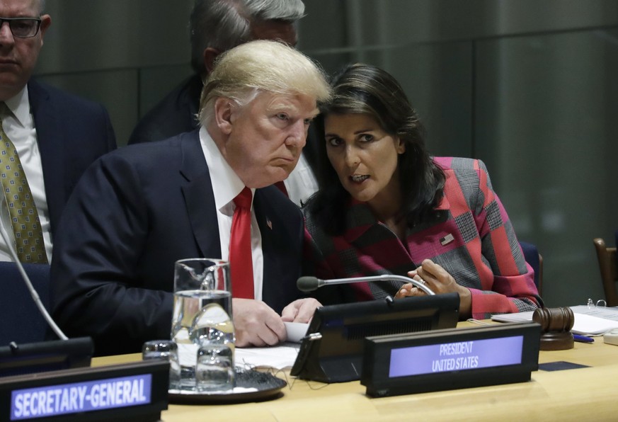 FILE- In this Sept. 24, 2018 file photo, President Donald Trump talks to Nikki Haley, the U.S. Ambassador to the United Nations, at the United Nations General Assembly at U.N. headquarters. Congressio ...