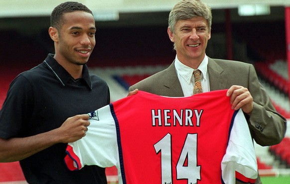 FILE - In this Tuesday, August 3, 1999 file photo Arsenal&#039;s latest signing, Thierry Henry, left, with Manager Arsene Wenger, pictured at Highbury in north London. Arsenal manager Arsene Wenger sa ...