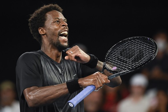 Gael Monfils of France celebrates after defeating Miomir Kecmanovic of Serbia in their fourth round match at the Australian Open tennis championships in Melbourne, Australia, Sunday, Jan. 23, 2022.(AP ...