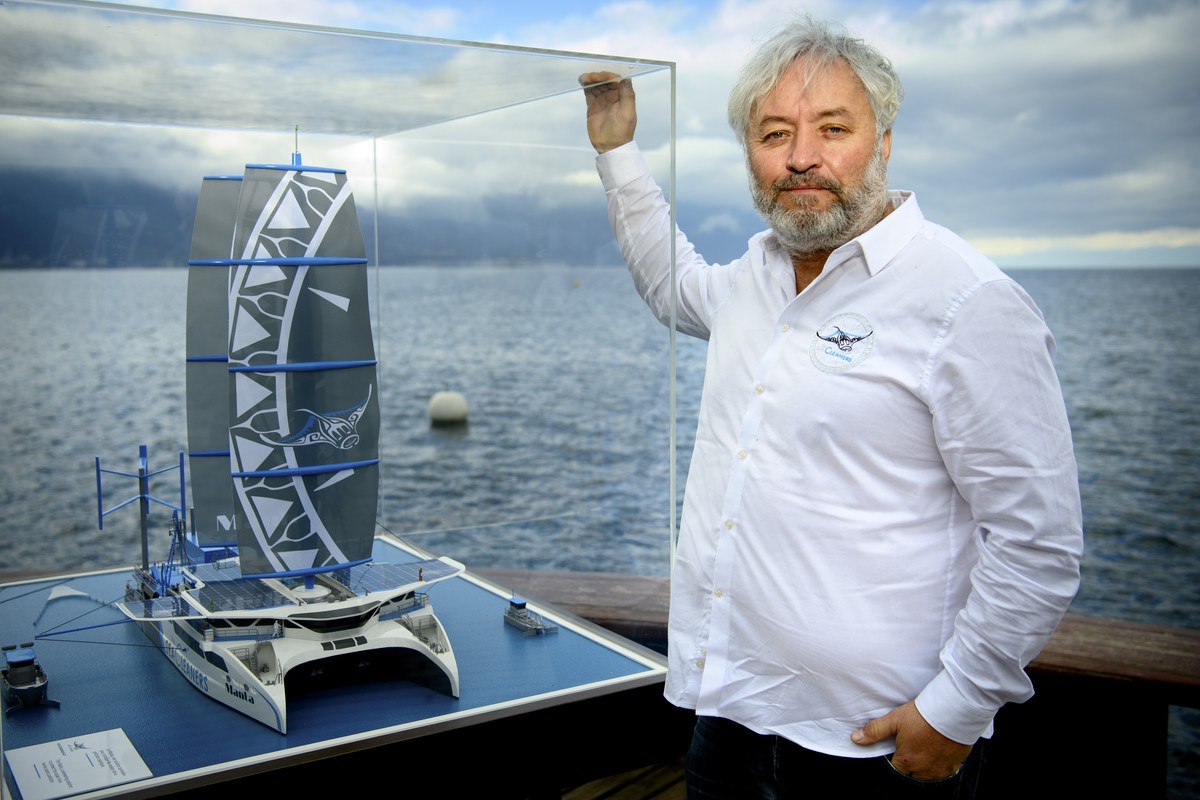 epa08998710 Swiss skipper and ecologist Yvan Bourgnon, Chairman and Founder of the NGO The SeaCleaners Swiss poses with the new model of his boat 'The Manta' on the shore of the Lake Geneva, ...