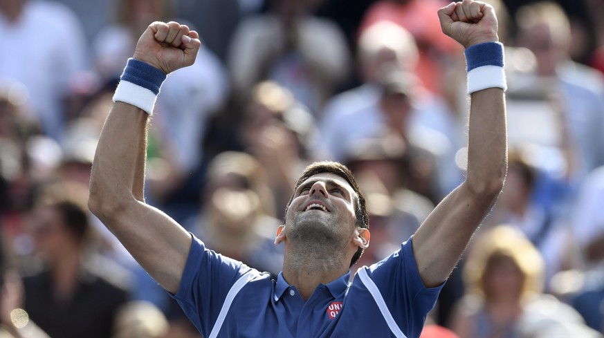 Novak Djokovic, of Serbia, celebrates his win over Kei Nishikori, of Japan, during the men&#039;s final of the Rogers Cup tennis tournament, Sunday, July 31, 2016, in Toronto. Djokovic won 6-3, 7-5.(F ...