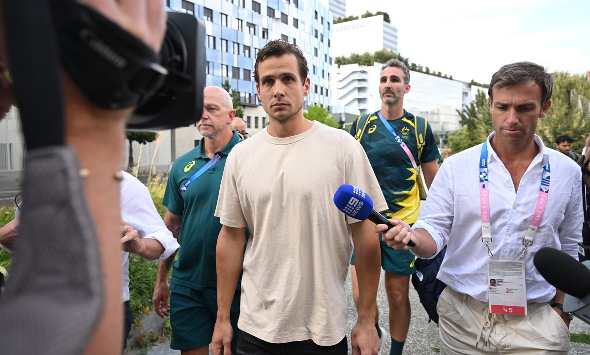 epa11534196 Australian field hockey player Tom Craig (C) is seen after his release from the Prefecture of Police following his arrest for allegedly attempting to buy cocaine on the streets in Paris, F ...