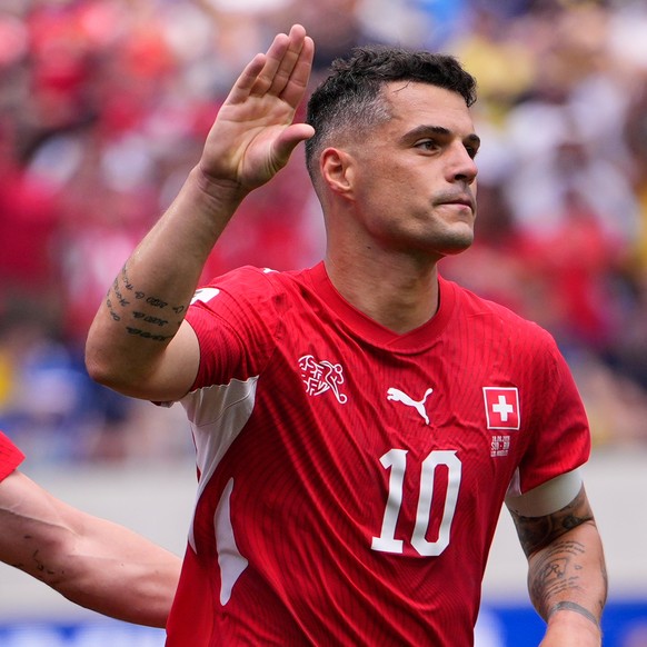 Switzerland's Granit Xhaka (10), center, celebrates with teammates after scoring their fourth goal against Bosnia during the World Cup Group B soccer match in Inglewood, Calif., near Los Angeles, ...