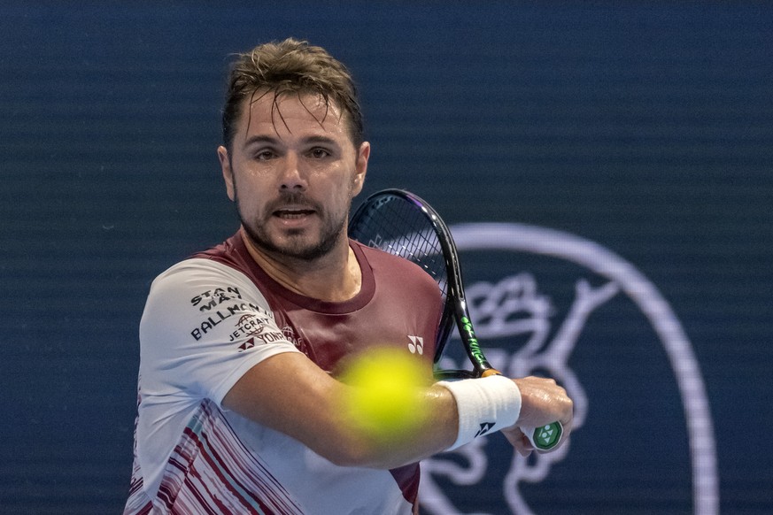 Switzerland&#039;s Stan Wawrinka returns a ball to Norway&#039;s Casper Ruud during their first round match at the Swiss Indoors tennis tournament at the St. Jakobshalle in Basel, Switzerland, on Tues ...