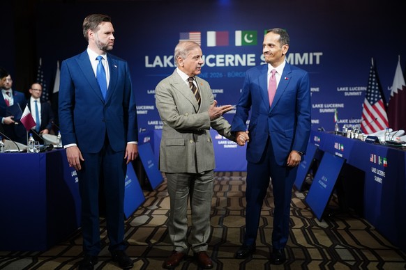 U.S. Vice President JD Vance, left, looks on as Pakistan's Prime Minister Shehbaz Sharif, center, speaks while gesturing towards Qatar's Prime Minister and Minister for Foreign Affairs Sheik ...