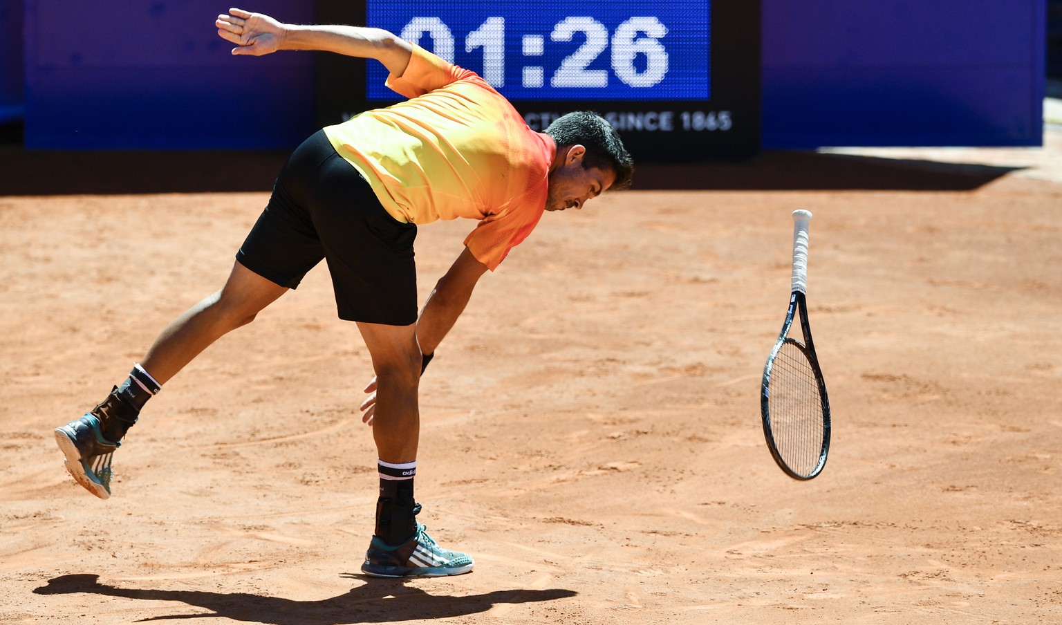 Yann Marti of Switzerland throws his racket as he reacts during a first round game at the Suisse Open tennis tournament in Gstaad, Switzerland, Monday, July 17, 2016. (KEYSTONE/Peter Schneider)