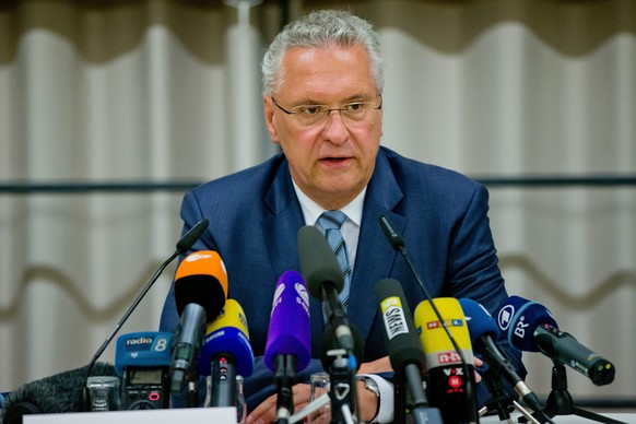 epa05439827 Bavarian Interior Minister Joachim Herrmann speaks during a press conference following an explosion in front of a restaurant in Ansbach, Germany, 25 July 2016. A man was killed and 12 othe ...