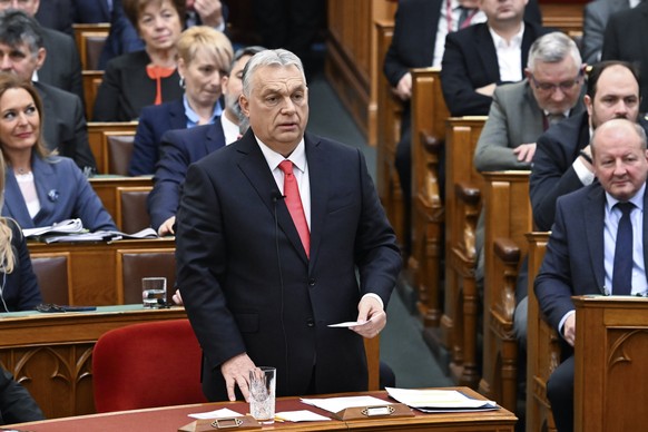 epa11921741 Hungarian Prime Minister Viktor Orban responds to the speeches of parliamentary faction leaders at the start of the spring session of the National Assembly in Budapest, Hungary, 24 Februar ...