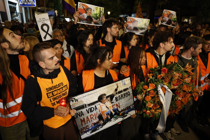 epa13290303 Demonstrators hold pictures of maria del Carmen Abascal during a protest organized by the Tenants' Union in Madrid, Spain, 08 October 2026. Thousands assembled to honor Abascal, an 87 ...