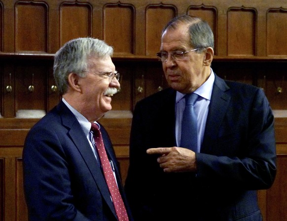 epa07112105 A handout photo made available by the Russian Foreign Ministry shows Russian Foreign Minister Sergei Lavrov (R) talking to U.S. National Security Advisor John Bolton (L) prior their negoti ...