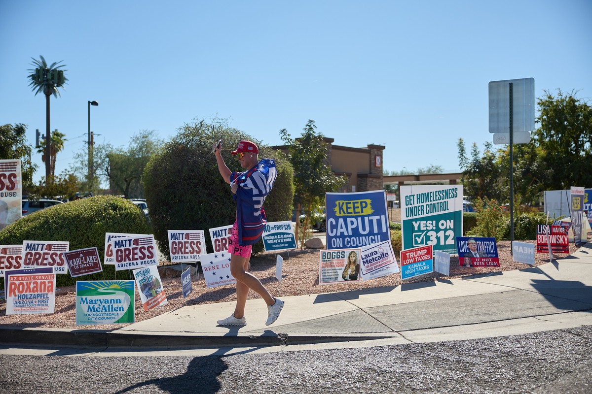 epa11703461 A supporter of Donald Trump arrives to a polling station on Election Day in Scottsdale, Arizona, USA, 05 November 2024. Voters across the country are casting ballots today for President of ...