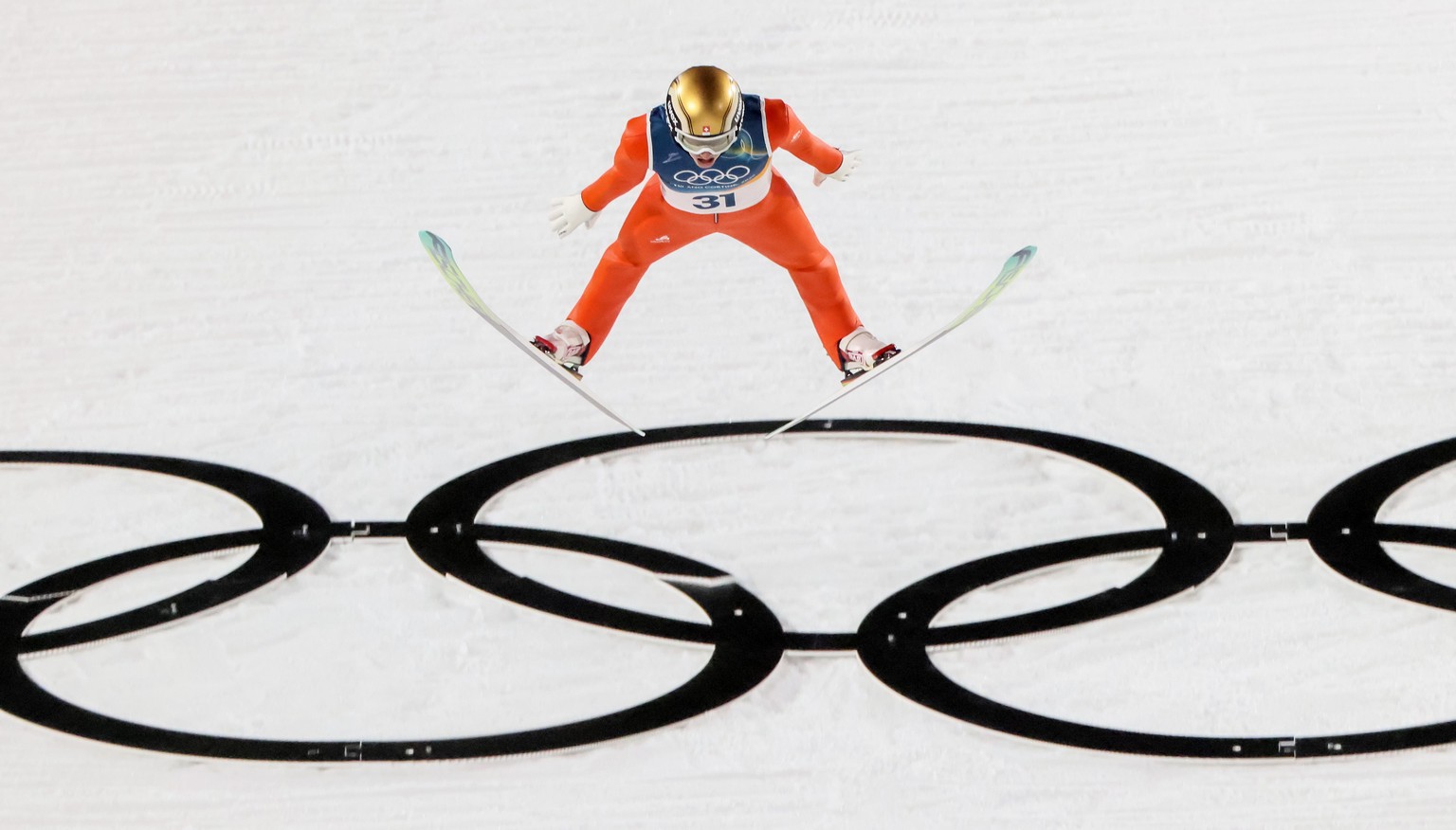 epa12722104 Gregor Deschwanden of Switzerland in action during the Men's Normal Hill of the Ski Jumping competitions at the Milano Cortina 2026 Winter Olympic Games, in Predazzo, Italy, 09 Februa ...