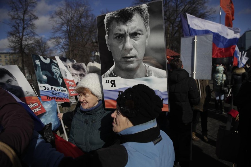 People gather together prior a march in memory of opposition leader Boris Nemtsov, who was killed two years ago, in Moscow, Russia, Sunday, Feb. 26, 2017. Several thousand people held a march in Mosco ...